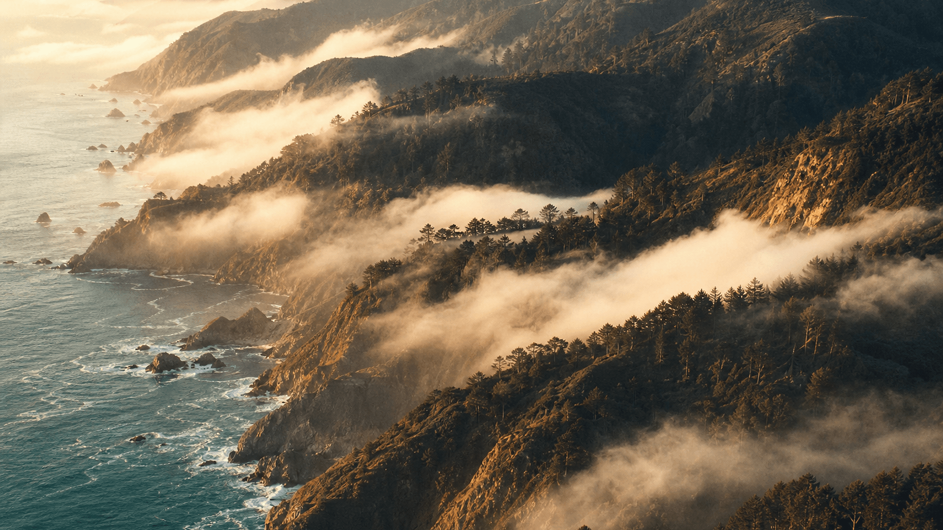 Big Sur headlands dropping into the Pacific Ocean at golden hour